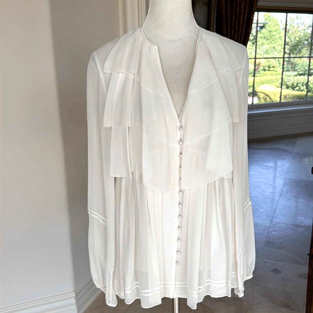 Off-white cream colored ruffle blouse